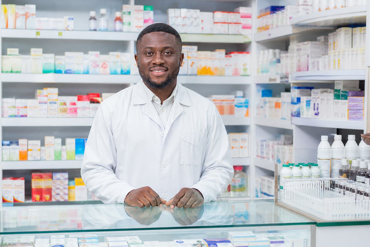 Pharmacist at a professional medicine counter in Accra